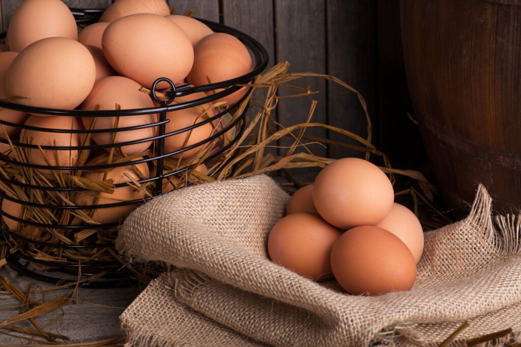 Farm Fresh eggs in basket depicting phrase "Putting all your eggs in one basket".