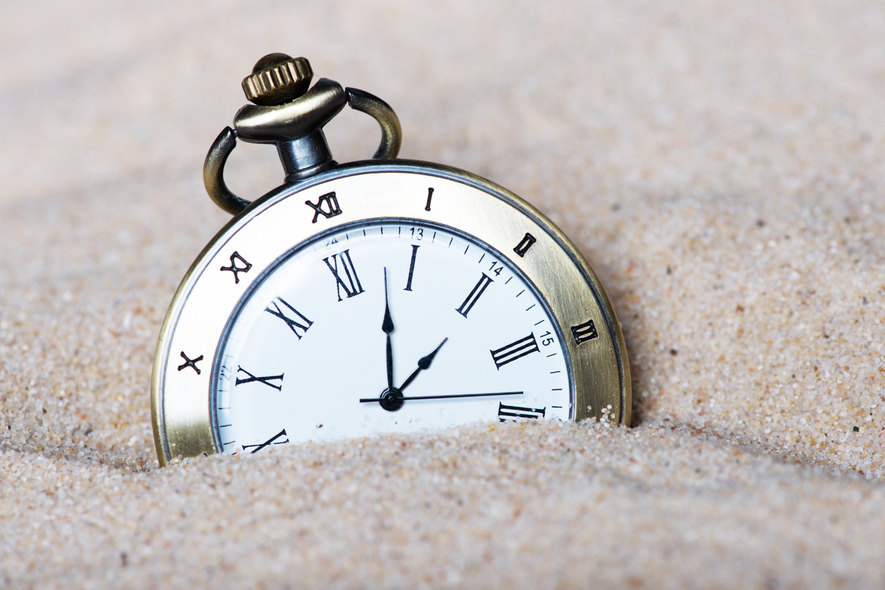 Clock stuck in sand